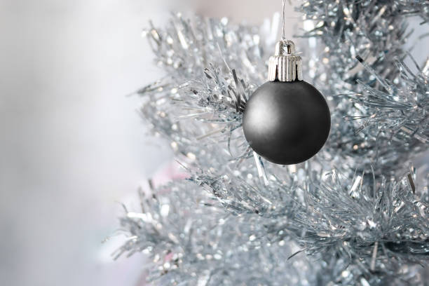White Christmas ornament in snow with a white background.PLEASE CLICK ON THE IMAGE BELOW TO SEE MY CHRISTMAS LIGHTBOX: