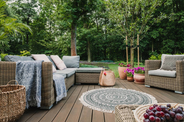 istock Garden patio decorated with Scandinavian wicker sofa and coffee table 1271350723
