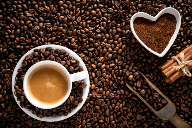 istock Latte milk Coffee cup on coffee beans low key 1271350902