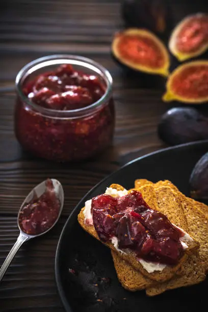 Photo of Figs jam homemade with fig fruits cheese and bread toast slice