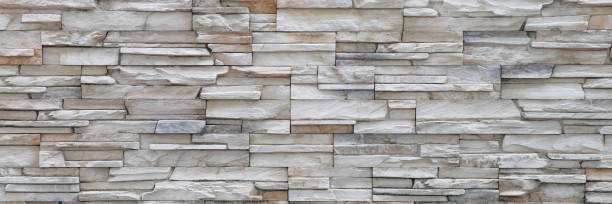 istock Stone background walls are stacked. Stone cladding background and wallpaper. 1271352403