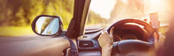 istock Driver driving a car on asphalt road in summer day 1271357293