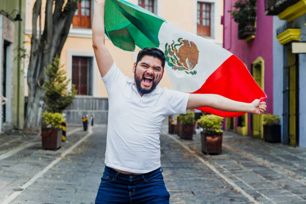 istock Mexican Man holding a flag of Mexico 1271367627