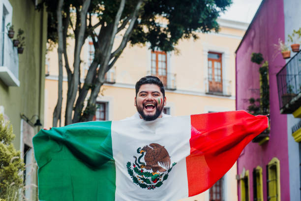 istock Mexican Man holding a flag of Mexico 1271367671