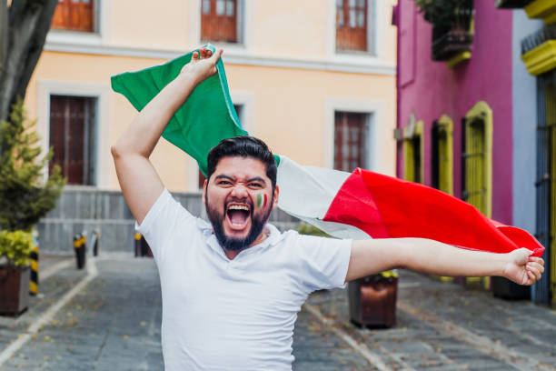 istock Mexican Man holding a flag of Mexico 1271367689