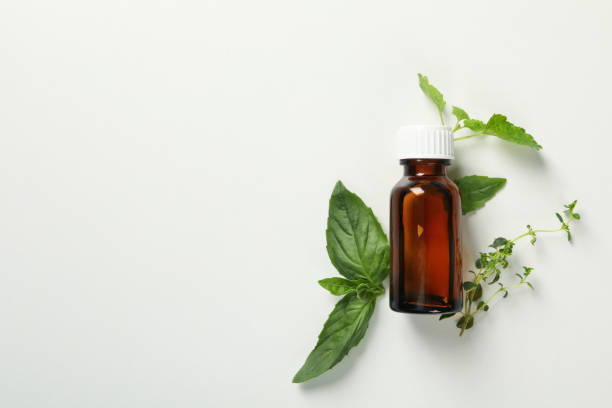 istock Medical bottle and herbs on white background, space for text 1271369232