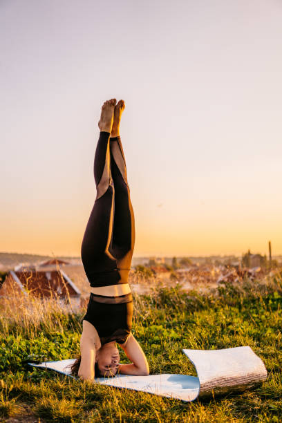 istock Woman doing candle yoga pose 1271369733