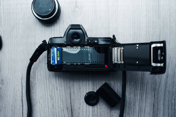 istock Old open film camera with new negative film 1271371279