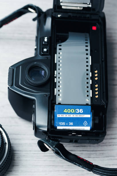 istock Old open film camera with new negative film 1271371285