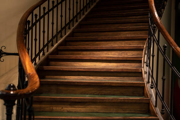 Elegant wooden staircase with railing.