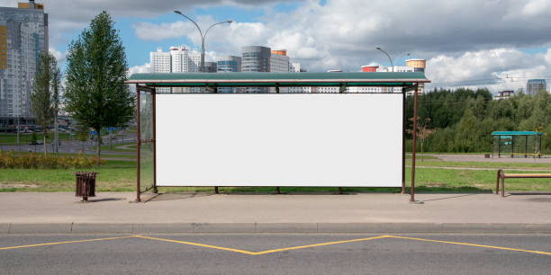 large blank white poster for mockup place in iron frame of bus stop - bus stop imagens e fotografias de stock