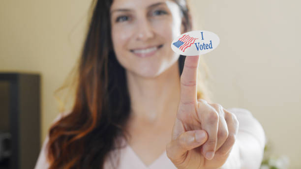 istock Woman with I Voted sticker 1271372972