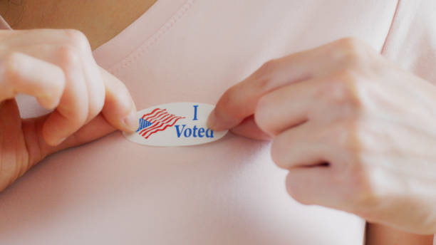 istock Woman with I Voted sticker 1271372976