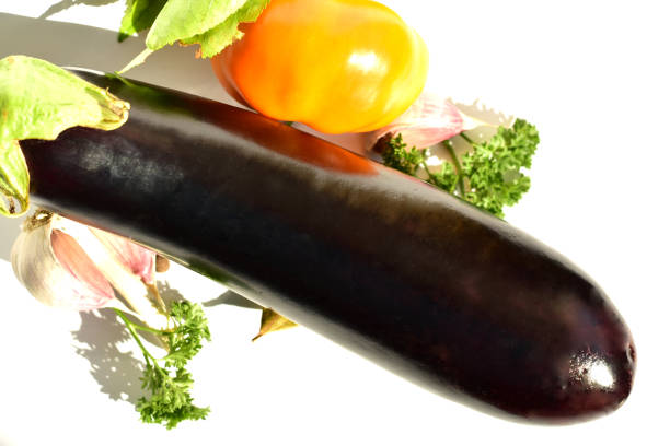 istock Ripe vegetable eggplant and bell pepper lie on the table. 1271373204