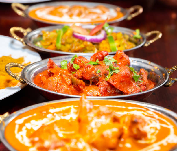 Chicken tikka masala spicy curry meat food with rice and naan bread