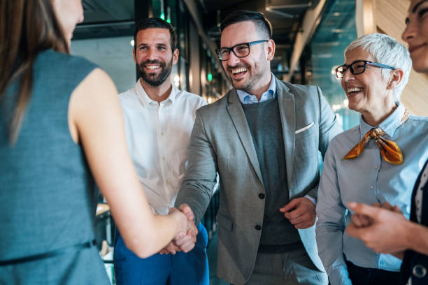 Handshake of business People Cheerful Business people shaking hands in the office coalition photos stock pictures, royalty-free photos & images