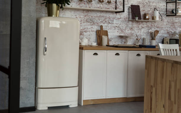 istock Antique retro fridge in kitchen with brick wall 1271377712