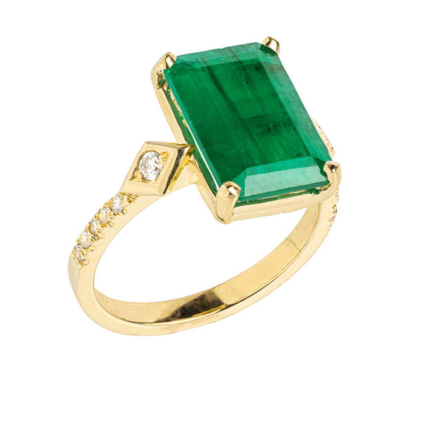istock Gold ring with gemstone and diamonds isolated on white background 1271377730
