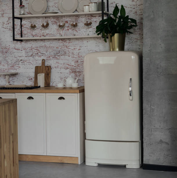 istock Retro fridge in wooden loft style kitchen 1271378278
