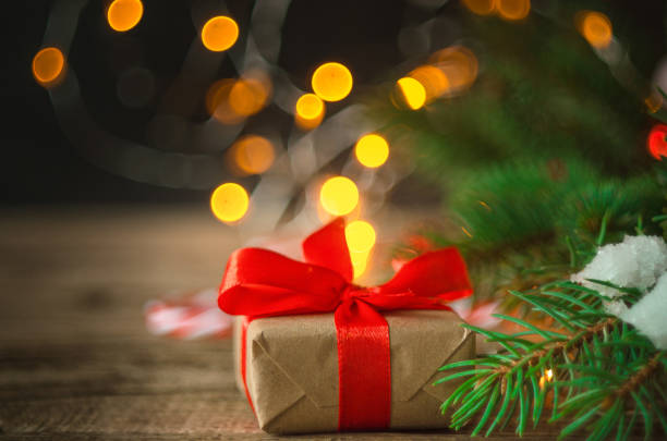 istock Christmas gift box. Christmas presents in red boxes at wooden table. Flat lay with copy space. wooden background. Winter holidays, New Year.Flat lay, top view, copy space. Selective focus. 1271378680