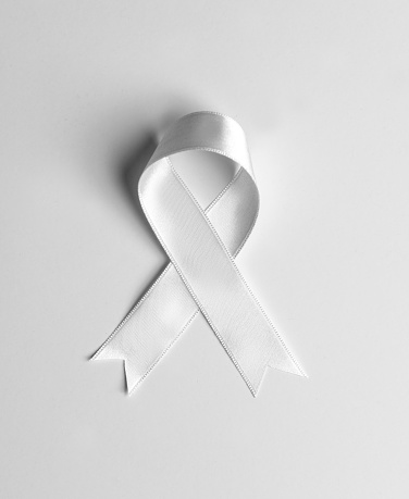White awareness ribbon on white background.