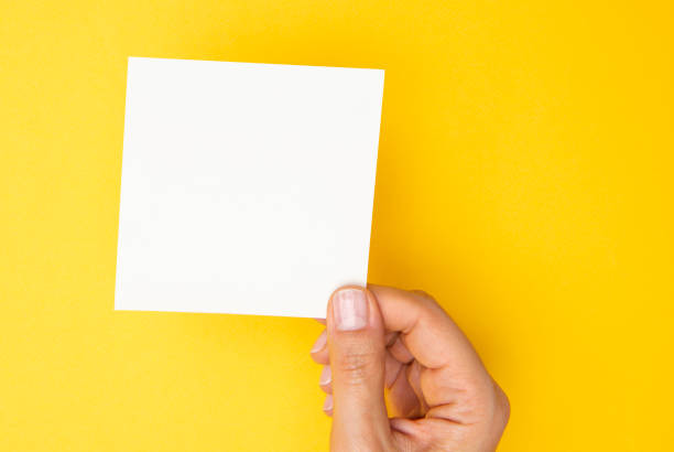 istock Woman Holding Paper 1271379972