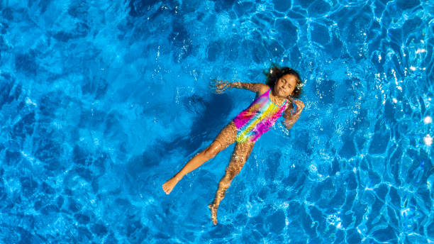 istock Children playing in the pool 1271381071