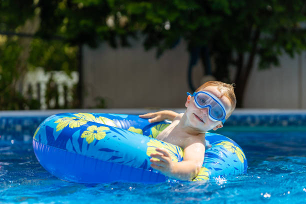 istock Children playing in the pool 1271381074