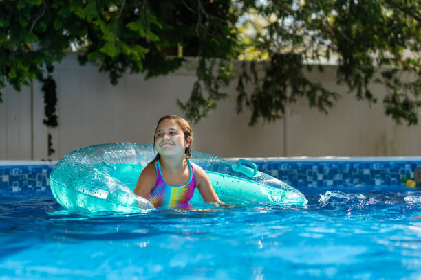 istock Children playing in the pool 1271381075