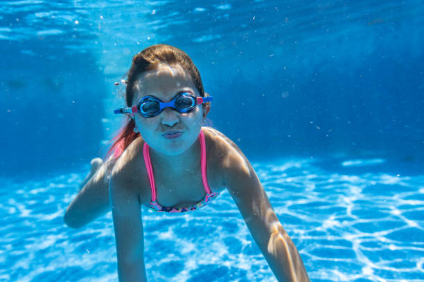 istock Children playing in the pool 1271381186
