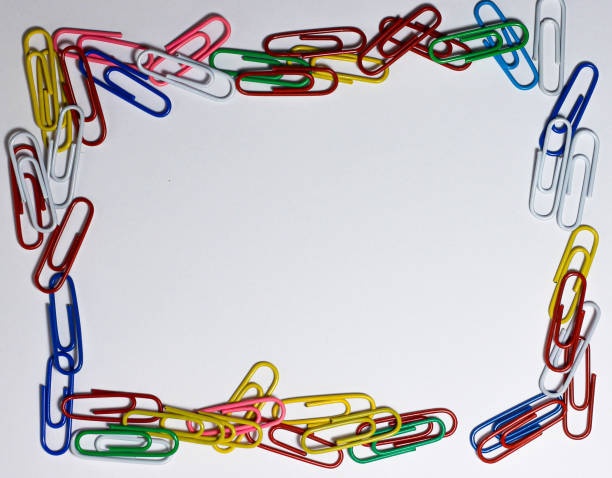 istock Colourful paper clips on a white background 1271382993
