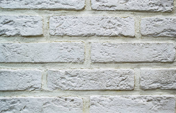 istock Facing tiles in the form of white bricks. White abstract background 1271388231