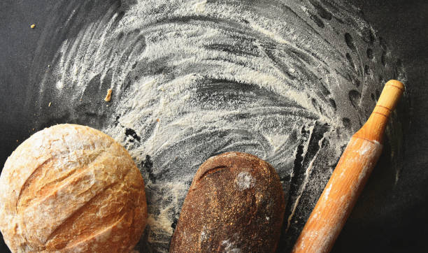 istock Bread, pin roll and flour top view 1271388684