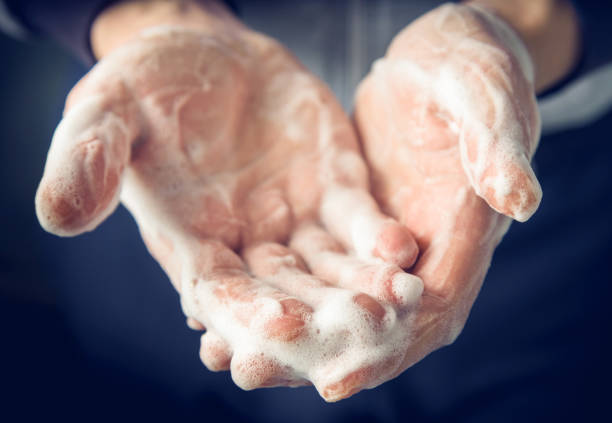 istock Man's hands washed with soap and foam 1271388719