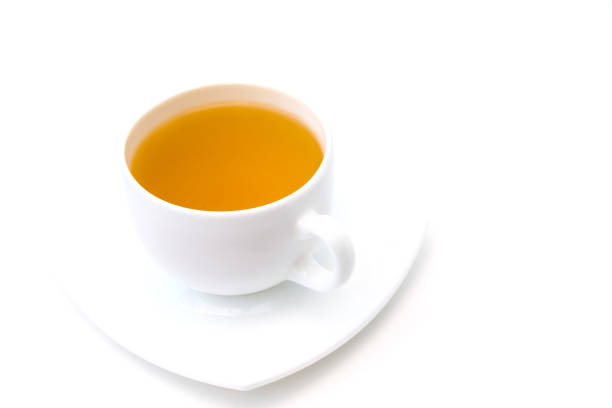 istock White porcelain cup with freshly brewed green tea isolated on white background. 1271390177