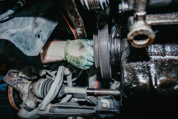 istock car crankshaft pulley repair in a workshop. 1271392129