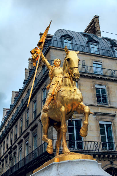 PARIS Statue of Joan of Arc on Place Pyramides in Paris, France. Joan of Arc, "The Maid of Orleans", is a folk heroine of France and a Roman Catholic saint. PARIS Statue of Joan of Arc on Place Pyramides in Paris, France. Joan of Arc, "The Maid of Orleans", is a folk heroine of France and a Roman Catholic saint. place des pyramides stock pictures, royalty-free photos & images