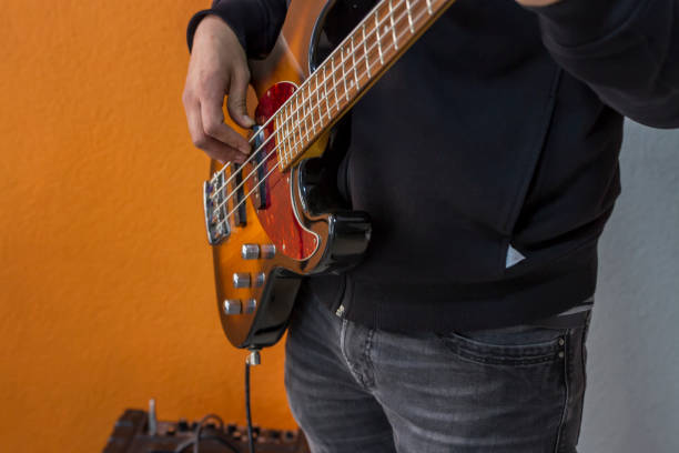 istock The Man Playing Guitar At Home 1271394147