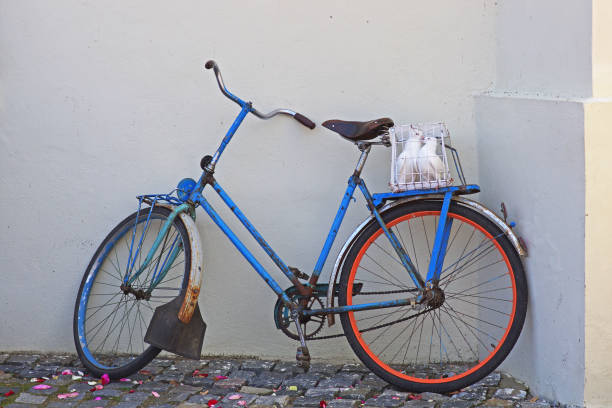 istock An old rusty Bicycle with white pigeons in a cage in the trunk 1271395620