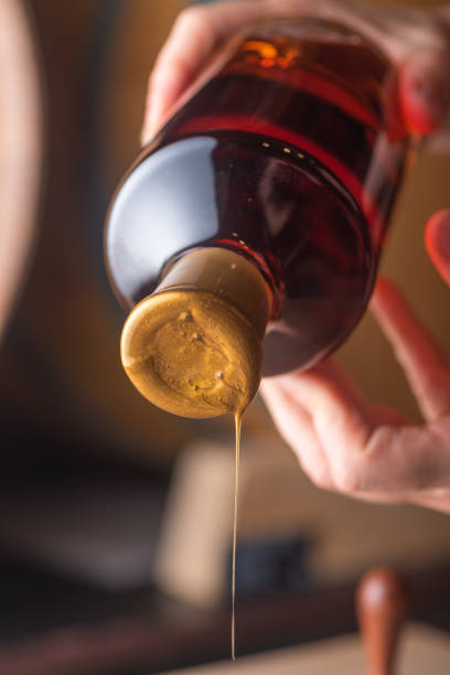 Sealing craft whiskey bottle with wax
