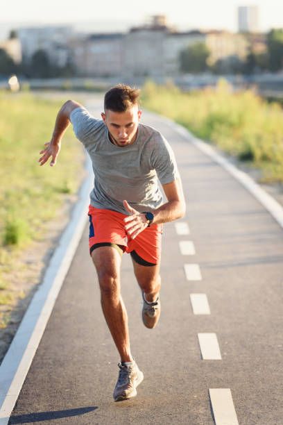 istock Sports man running fast outdoors on a race track 1271398444