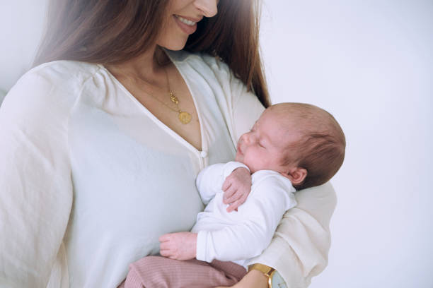 istock Mother and baby standing 1271398952