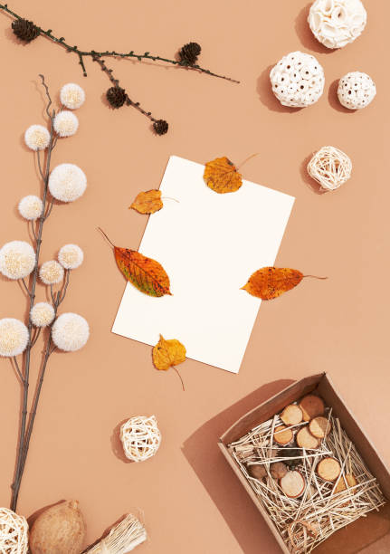 istock Autumn background with fall winter decor, blank stationary template, invitation mock up, empty paper card with copy space for text from top on beige background. Top view. Flat lay. Fall winter seasons 1271400066
