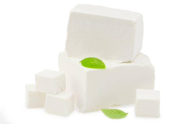 istock feta cheese with basil isolated on white background. Clipping path and full depth of field 1271400187