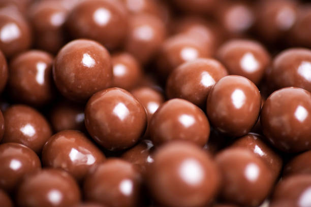 istock Chocolate ball candy sweet snack dessert on a pile making a background 1271400923