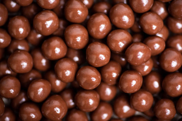 istock Chocolate ball candy sweet snack dessert on a pile making a background 1271401464