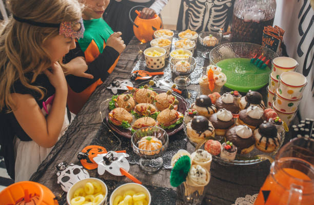 istock Kids eating on Halloween party 1271401903