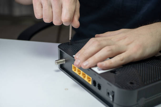 istock Wi-Fi Modem Device  Repairment with Micro Screwdriver 1271405170