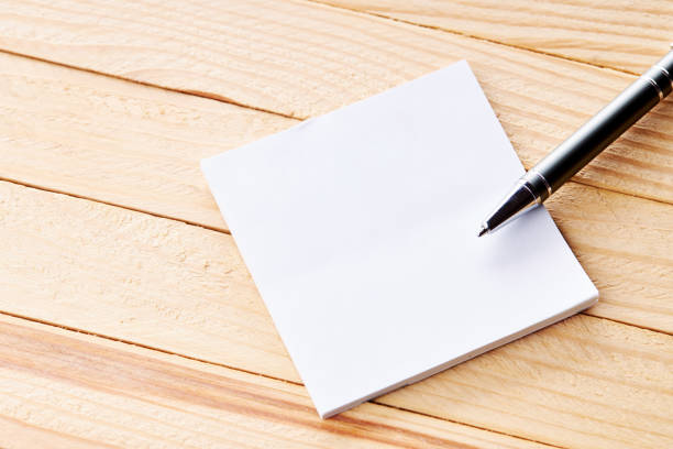 istock office workplace with blank sticky note. above view. wooden desk. background backdrop 1271406223