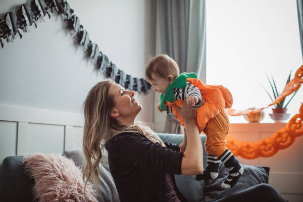 istock Mother and baby playing on Halloween 1271408695